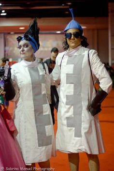 two people in costumes standing next to each other