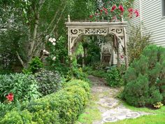 a garden with flowers and plants around it