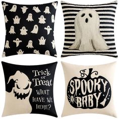 four pillows with black and white designs on them, one has a ghost in the middle