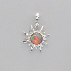 This is a lab created Fire Opal pendant. The pendant is made out of solid 925 Silver and there is no nickel or other substances causing most allergies. This makes the earrings hypo allergenic. The size of the pendant - incl. bail - is 3.4 x 2.3 cm or 1.34 x 0.91 inch Please note: Our jewelry is photographed close up to show detail and may appear larger than they are. We are happy to help with any questions. We use a dime coin as size reference on one of the pictures. You will receive the item in Silver Opal Dangle Jewelry, Cadmium-free Sterling Silver Round Pendant Jewelry, Cadmium-free Sterling Silver Round Pendant, Cadmium-free Round Silver Jewelry, Silver Hypoallergenic Jewelry With Round Pendant, Silver Opal Round Jewelry, Silver Hypoallergenic Round Pendant Jewelry, Vintage Silver Opal Round Jewelry, Nickel-free Opal Pendant Jewelry