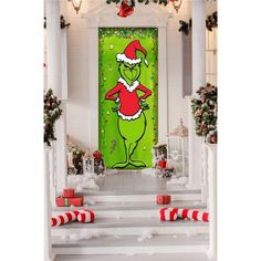 the grinch door is decorated with christmas decorations