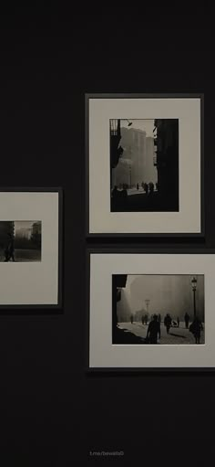 three black and white photographs hanging on a wall