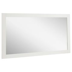 a white framed mirror on a wall