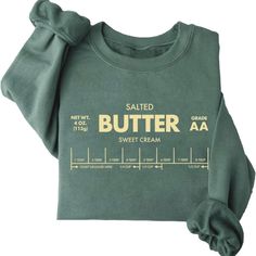 Every One Loves Butter! This Traditional Style Print Of Your Favorite Baking Stick Printed On Our Favorite Super Soft Pullover Is The Best Gift To Get Yourself Or Your Bestie For The Cozy Season Ahead!! Fitted Crew Neck Sweater With Letter Print, Fitted Green Cotton Sweatshirt, Fitted Fall Sweater With Letter Print, Fitted Green Crew Neck Sweatshirt, Cute Fitted Crew Neck Sweater, Fitted Cute Crew Neck Sweater, Fitted Crew Neck Sweater In Cute Style, Black Sweatshirt Women, Nike Crewneck Sweatshirt