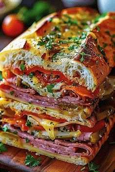 several sandwiches stacked on top of each other with meat and cheese in the middle, sitting on a cutting board