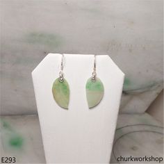 Jade leaf earrings •Color: White base with splotches green•Size: 22.5 + 12 mm •Thickness: 1.6 mm•Weight: 2.5 grams with setting•Setting: Sterling silver •Translucency: Opaque•Code: E293Symbolizes: Good luck, protection, longevityThese handcrafted jade earrings are guaranteed to be 100% natural, non-enhanced, and untreated.We do our best to keep the photos the same as the item; these photos are not enhanced or edited. Please keep in mind that the color may vary on different monitors.•Should you find that this piece does not meet your expectations, we do accept returns within 7 days of receiving the product. However you must notify us within 24 hours of receiving the item. For more details on our Payment and/or Return policy, please visit the following link:http://www.churkworkshop.com/pages Cheap Handmade Jade Earrings, Jade Earrings, Earrings Color, Leaf Earrings, Good Luck, Return Policy, Jade, Color White, Sterling Silver