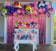 a birthday party with balloons and decorations