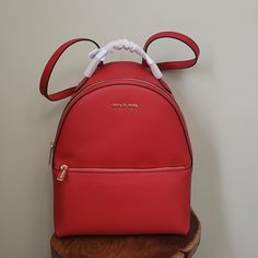 From Gym Sessions To City Commutes, Our Sheila Backpack Has You Covered. The Textured Style Comes With A Dedicated Pocket Inside For Your Tablet, As Well As A Front Zip Pouch For Smaller Items. Adjust The Buckled Straps On The Back For The Perfect Drop. Red Backpack, Bags Michael Kors, Exterior Details, Zip Pouch, Michael Kors Bag, Bright Red, Interior Details, Inside Pocket, Zip Pockets