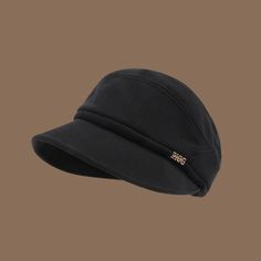 a black hat on a brown background