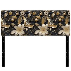 an ornate headboard with gold flowers and pearls on black metal frame, isolated against a white background