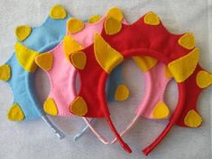 three children's headbands made out of felt