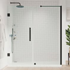 a white tiled bathroom with black trim and glass shower door, wood flooring and towel racks