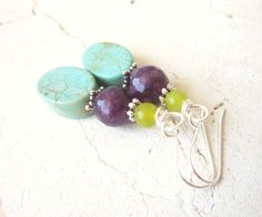 "These multi semi precious stone dangle earrings are made of oval green turquoise stones, round amethyst jade, yellow turquoise stones. I accented the stones with Bali sterling silver spacers. They measure 1 3/4\" in length from the top of the sterling silver earwire. Lightweight and comfortable for all day wear. Pair these with your other southwest jewelry or wear them on their own for a pop of color for your ears. See the matching BRACELET here: All my jewelry comes gift boxed with a bow ready Turquoise Gemstone Beads Earrings As Gift, Turquoise Gemstone Earrings With Round Beads, Turquoise Jade Earrings For Gift, Green Gemstone Beads Round Earrings, Green Gemstone Beaded Round Earrings, Green Round Gemstone Bead Earrings, Turquoise Jade Earrings With Natural Stones, Multicolor Earrings, Stone Dangle Earrings