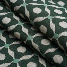 green and white fabric with circles on it