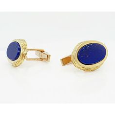 A fine pair of English Modernist cufflinks.  By Kutchinsky, the renowned London jewelry house.  In 18k gold and set with flat oval lapis cabochons.  Marked for 1970, a period in which Joseph Kutchinsky was at the height of his design influence.  These Modernist cufflinks have a wonderful tapered edge with hand tooling that obviously borrows design elements from Andrew Grima's work.  Fully hallmarked.  Simply wonderful high-level English Mid-Century Modern cufflinks!  Date: Mid-20th Century, 1970 Elegant Oval Cufflinks For Formal Occasions, Oval Gold Jewelry For Business, Oval Yellow Gold Jewelry For Business, Luxury Oval Cufflinks For Formal Occasions, Elegant Oval Cufflinks For Business, Luxury Oval Cufflinks As Gift, Oval Yellow Gold Cufflinks For Gift, Oval Polished Cufflinks For Business, Classic Oval Yellow Gold Cufflinks