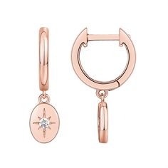 PRICES MAY VARY. Our hinged huggie earrings featuring a beautiful cubic zirconia starburst dangle are the perfect combination of trendy and classic. These gorgeous 14K rose gold plated women's huggies with a sterling silver post and hinge closure are 13mm in diameter and measure 1.7mm wide. Dangling from the mini hoop earring is a 8x6mm oval starburst with AAAAA quality cubic zirconia. ✦ 60-DAY GUARANTEE ✦ Your happiness is our number one priority. To ensure your complete satisfaction, we offer