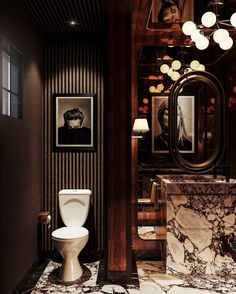 a bathroom with a marble counter top next to a toilet