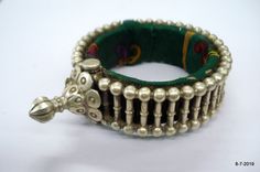 "VINTAGE ANTIQUE GREAT DESIGN TRIBAL OLD SILVER HINGE BRACELET BANGLE (KAKAN) FROM RAJASTHAN INDIA. Silver guard bangles (Khatria or bangri gokru) with solid balls perimeters. Worn by DANGEE and PATEL tribal people of Rajasthan. One quarter-hinged part can be opened by central pin. Piece is good worn with a great antique look. See similar samples in\" Traditional jewelry of India\" by Oppi Untractht. Inner diameter - 4.8 cm(1.89\") Outer diameter - 6.8 cm(2.7\") Inner circumference - 15 cm(5.9\" Antique Silver Bracelet For Festivals, Antique Silver Bangle Bracelets For Festivals, Vintage Oxidized Finish Bracelets For Festivals, Vintage Oxidized Finish Bangle For Festivals, Vintage Oxidized Bangle For Festival, Vintage Oxidized Bracelets For Festivals, Antique Silver Bracelets For Festivals, Traditional Antique Silver Bracelet For Festive Occasions, Vintage Tilla Bracelets For Festive Occasions