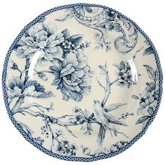 a blue and white plate with flowers on it