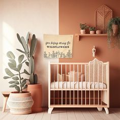 a baby crib next to a potted plant