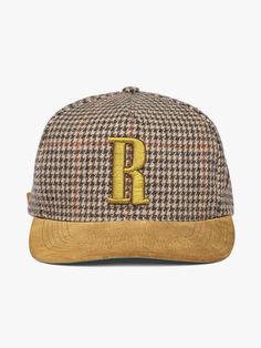 Heavyweight vintage houndstooth adjustable cap with “R” embroidered on the front. Featuring a suede brim, suede button at crown, custom Rhude hardware, and embroidered details on sides.   Commemorating our AW24 Paris Fashion Week Show "Out of Range".  RHUDE WEBSITE EXCLUSIVE WOOL VISCOSE AND SUEDEONE SIZE FITS ALL2.25" BRIM LENGTH WE RECOMMEND USING A SUEDE PROTECTOR PRIOR TO USESPOT CLEAN WITH DISTILLED SOAPY WATER Winter Brown Flat Bill Baseball Cap, Luxury Brown Hat With Embroidered Logo, Brown Snapback Baseball Cap With Embroidered Logo, Classic Snapback Flat Cap With Embroidered Logo, Classic Embroidered Snapback Flat Cap, Luxury Adjustable Brown Baseball Cap, Brown Snapback Hat With Embroidered Logo, Brown Flat Brim Hat With Embroidered Logo, Brown Embroidered Snapback Hat