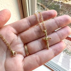 Beautiful, dainty 18k gold filled crucifix necklace.  Lead and nickel free; do not tarnish easily. Necklace length: 21.5 inches Perfect for a Baptism, First Communion, Confirmation, Mother's Day gift, Birthday gift, Easter gift or 'just because' gift! These necklaces are designed and handmade by me in my studio.  Custom rosaries and other jewelry available. Please feel free to message me. Thank you! Custom Rosary, Crucifix Necklace, Catholic Jewelry, Just Because Gifts, Christian Jewelry, Easter Gift, Necklace Length, Gift Birthday, Jewelry Art