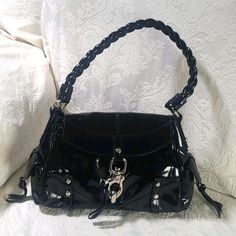 Nwot Francesco Biasia Shoulder Bag Black Leather Braided Shoulder Strap Dual Exterior Pockets Logo Jacquard Lining & Single Interior Pocket Clasp Closure At Front Stamped Silver Hardware Shoulder Strap Drop: 7" Height: 9" Width: 14" Depth: 5.5" Evening Shoulder Bag With Silver Accents, Black Shoulder Bag With Silver Accents For Everyday Use, Chic Black Bags With Silver Accents, Elegant Shoulder Bag With Silver Accents, Elegant Shoulder Bag With Silver Accents For Everyday, Black Bag With Silver Accents For Formal Occasions, Black Formal Bag With Silver Accents, Black Bags With Silver Accents For Formal Occasions, Formal Black Bag With Silver Accents