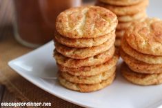 a stack of cookies sitting on top of a white plate