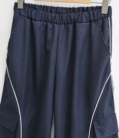 Women Relaxed Front Pocket Cargo Trousers With Striped Detail – Sun-Imperial Sporty Navy Pants With Pockets, Navy Wide Leg Cargo Pants With Pockets, Navy Casual Cargo Pants With Pockets, Casual Navy Cargo Pants With Pockets, Navy Casual Cargo Pants, Navy Pants With Pockets For Summer, Navy Summer Pants With Pockets, Navy Bottoms With Side Pockets For Spring, Casual Navy Bottoms With Patch Pockets