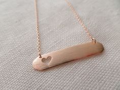 "So sweet and adorable, you would want to wear it everyday! Simply leave it blank or have an initial stamped on right corner of the bar Comes in a Gift Box . Ready for your special presentation -Brushed Gold, Rose Gold, Silver plated bar with heart cut out 1 3/8\" X1/4\" -Gold, Rose Gold, or Silver plated chain -Lobster clasp PLEASE LET ME KNOW THE LETTERS AND INSERT CARD YOU WANT IN THE NOTE TO SELLER SECTION AT CHECK OUT Steps to PURCHASE the Necklace STEP1: Choose your Necklace Color (Gold, R Personalized Minimalist Rose Gold Heart Necklace, Personalized Delicate Rose Gold Heart Necklace, Minimalist Rose Gold Bar Necklace For Gift, Minimalist Rose Gold Bar Necklace As Gift, Rose Gold Bar, Simple Birthday, Silver Bar Necklace, Gold Bar Necklace, Silver Bar