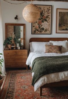 a bed sitting in a bedroom next to a wooden dresser and mirror on top of a rug