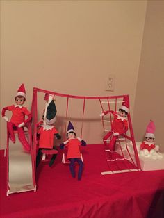 the elfs are playing with their toys on the bed