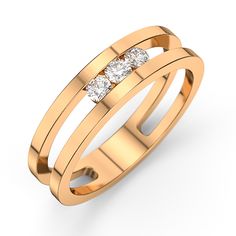 a gold ring with three diamonds on it