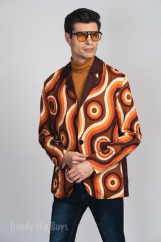 * Men's Retro Blazer: A stylish groovy brown blazer that brings 70s style to life. * Groovy Brown 70s Style Blazer: Perfectly captures the essence of vintage fashion with its retro design. * Vintage Style Men's Blazer: A must-have for anyone looking to add a touch of retro charm to their wardrobe. * 70s Inspired Cotton Blazer for Men: Made from high-quality cotton for comfort and durability. * Men's Brown Blazer: Ideal for vintage-inspired outfits or making a bold fashion statement. Classic Men's Blazer: Perfect for parties, special events, or adding a retro vibe to your everyday look. Fabric: 100% Cotton Regular fit Flat Lapel Collar, long sleeve, two pocket Fabric weight: 245g/m² Care Instruction: machine wash cold with similar colors, do not bleach, tumble dry low, do not iron, do not d Luxury Vintage Multicolor Blazer, Brown Sport Coat For Spring With Lapel Collar, Spring Brown Single-breasted Sport Coat, Retro Tailored Long Sleeve Blazer, Retro Winter Blazer With Lapel Collar, Retro Brown Outerwear For Work, Retro Brown Long-sleeved Outerwear, Retro Brown Long Sleeve Outerwear, Retro Notch Lapel Outerwear For Fall