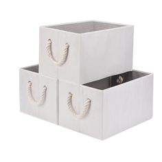 two white storage boxes with handles and rope on the sides, one for each drawer