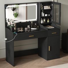 a black vanity with mirror and lights on it