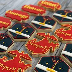 decorated cookies are arranged on a wooden table