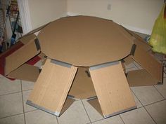 several cardboard boxes stacked on top of each other in the middle of a kitchen floor