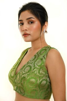 Elevate your ethnic look with this stunning Green Sleeveless Brocade Silk Blouse featuring a stylish V Neckline. Perfect for pairing with a saree or lehenga. Traditional Sleeveless Pre-draped Saree With Pallu, Festive Sleeveless Chanderi Pre-draped Saree, Festive Chanderi Sleeveless Saree, Elegant Sleeveless Chanderi Pre-draped Saree, Sleeveless Chanderi Pre-draped Saree For Festive Occasions, Traditional Sleeveless Pre-draped Saree For Festive Occasions, Festive Sleeveless Pre-draped Saree With Zari Work, Festive Anarkali Saree, Traditional Sleeveless Chanderi Pre-draped Saree