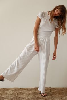 Our best-selling simple pant reimagined in a cropped silhouette. The Pointelle Simple Crop Pant is super-soft, effortless and versatile. Pairs perfectly with The Pointelle Sqaure Neck Tank and The Pointelle Baby Tee Made in LA High Waist Relaxed Fit Culottes With Elastic Waistband, High Waist Culottes With Elastic Waistband And Relaxed Fit, Chic Cropped Bottoms For Daywear, Cropped Summer Bottoms For Daywear, Elegant White Cropped Bottoms, High-waisted Wide Leg Pants With Elastic Waistband, Elegant Cropped Bottoms For Spring, Cropped Bottoms With Elastic Waistband For Loungewear, Stretch Wide Leg Bottoms For Daywear