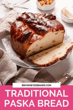 a loaf of bread sitting on top of a plate next to a knife and bowl