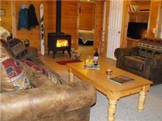 a living room filled with furniture and a fire place