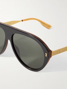 Gucci has always favoured a maximalist approach to design, especially with its sunglasses. These acetate shades have exaggerated aviator-style frames offset by gold-tone arms detailed with the house moniker at the temples. Tone Arms, Gucci Eyewear, Toned Arms, Aviator Style, Cycling Accessories, Sunglasses For Men, Eyewear Accessories, Luxury Gifts, Mr Porter