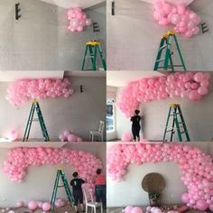 pink balloons are being put on the wall