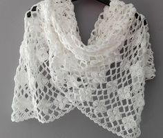 Fine white summer scarf, handmade of cotton / acrylic yarn, crochet lace. Nice accessory for both summer day and evening. Made in smoke free, pet friendly environment Washing: Hand wash, water 30 degrees. Do not tumble dry. For best results use softener. Leave on a flat surface to dry out, away from the sun. Length: 76'' or 190 cm Width: 17'' or 44 cm Weight: 150 g Yarn: YarnArt Cotton Soft, 55% cotton 45% acrylic Color: White White Crochet Scarf, Evening Scarf, Beach Scarf, Scarf Summer, White Shawl, Summer Shawl, Scarf Handmade, White Beach, Lace Scarf