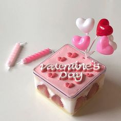 there is a cake with hearts and balloons on it that says valentine's day