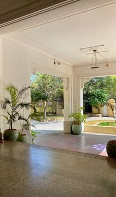 the inside of a house with potted plants