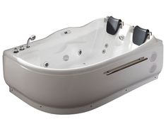 a white bath tub sitting on top of a white floor