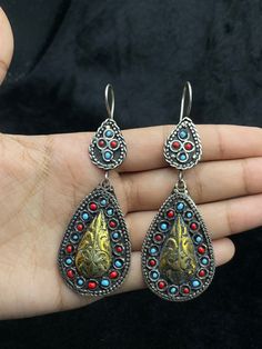 A Very Beautiful Handmade Turkmen Silver Gold Plated Earrings From Afghanistan. Shipping Payment Feedback & Return Policy 1 : We ship Monday to Friday Via Airmail Register Insured  With Tracking # takes 2 to 4 Weeks to Destination. 2 : Contact us if you did not receive your item after 4 weeks. 3 : We Accept Payment Only Via PayPal. 4 : In Any Inconvenience Case we do Accept Return and full Refund. 5 : We Ship worldwide via Airmail Registered with Tracking # provided to buyer after shipping . 6 : Traditional Turquoise Earrings With Latkans, Traditional Turquoise Danglers For Gift, Blue Metal Earrings With Latkans, Festival Turquoise Metal Earrings, Traditional Turquoise Drop Earrings, Traditional Turquoise Earrings As A Gift, Traditional Turquoise Teardrop Beaded Earrings, Traditional Silver Teardrop Beaded Earrings, Turquoise Dangle Earrings For Festival