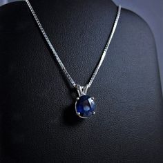 "Genuine Royal Blue Sapphire Pendant Necklace DESCRIPTION This is a large, gorgeous dark blue Sapphire gemstone. Sturdily set in the precious metal of your choosing and suspended from a sparkling Italian diamond-cut chain of matching precious metal. Simply Elegant and Classy. This deep ocean blue Sapphire can be seen sparkling from across the room. * Please allow 1-2 weeks processing time for 14k Gold Options of this necklace as it will be specially made for you. DETAILS {You will receive the Sa Sapphire Oval Pendant Necklace For Weddings, Blue Gemstone Necklace With Lab-created Sapphire, Blue Lab-created Sapphire Gemstone Necklaces, Blue Lab-created Sapphire Necklace For Anniversary, Blue Sapphire Round Pendant Jewelry, Blue Lab-created Sapphire Pendant Jewelry, Blue Oval Pendant Necklace For Wedding, Blue Oval Pendant Necklace For Anniversary, Royal Blue Sapphire Ring